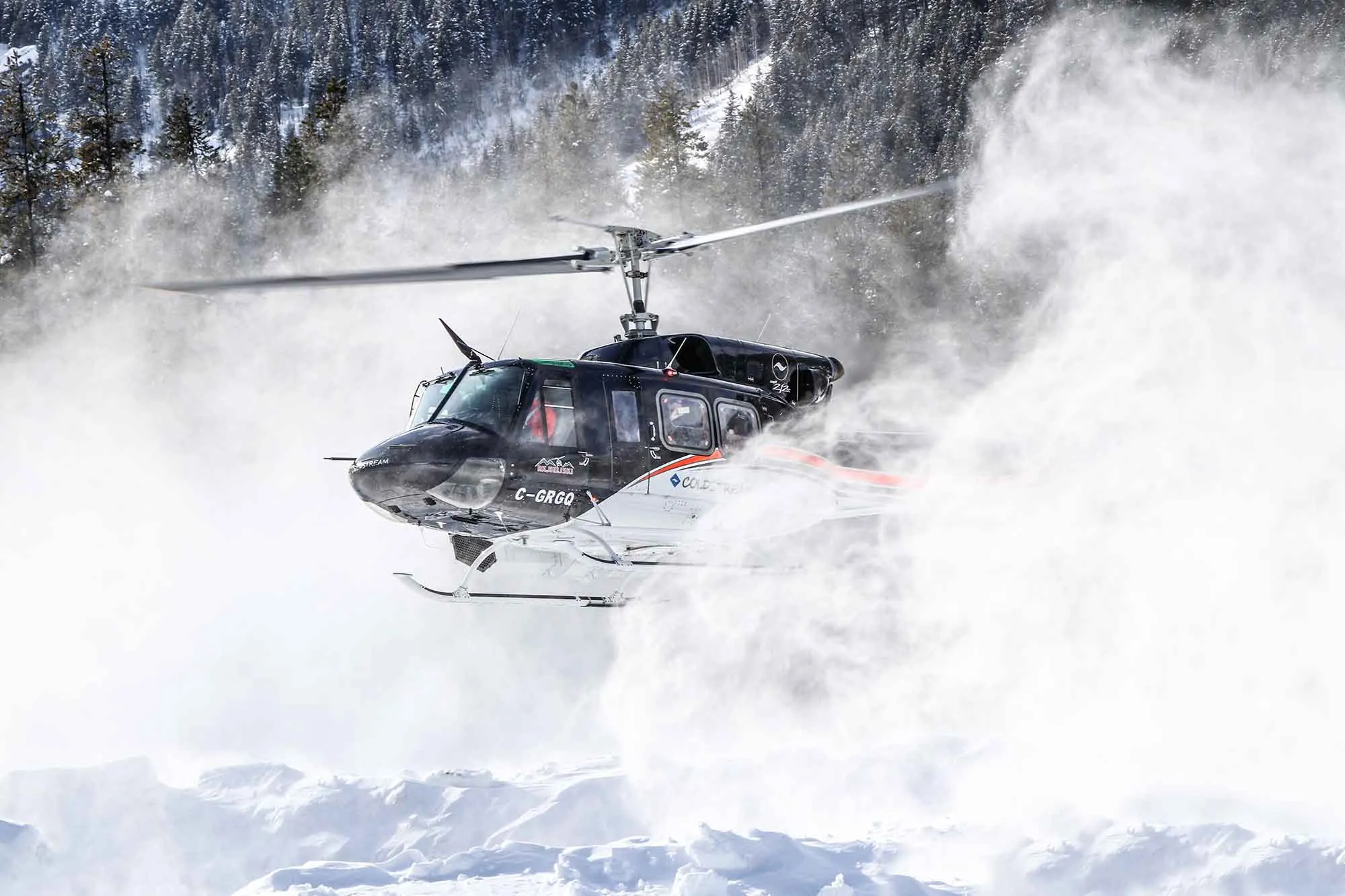 Coldstream Bell 212 hovering in light snow cloud