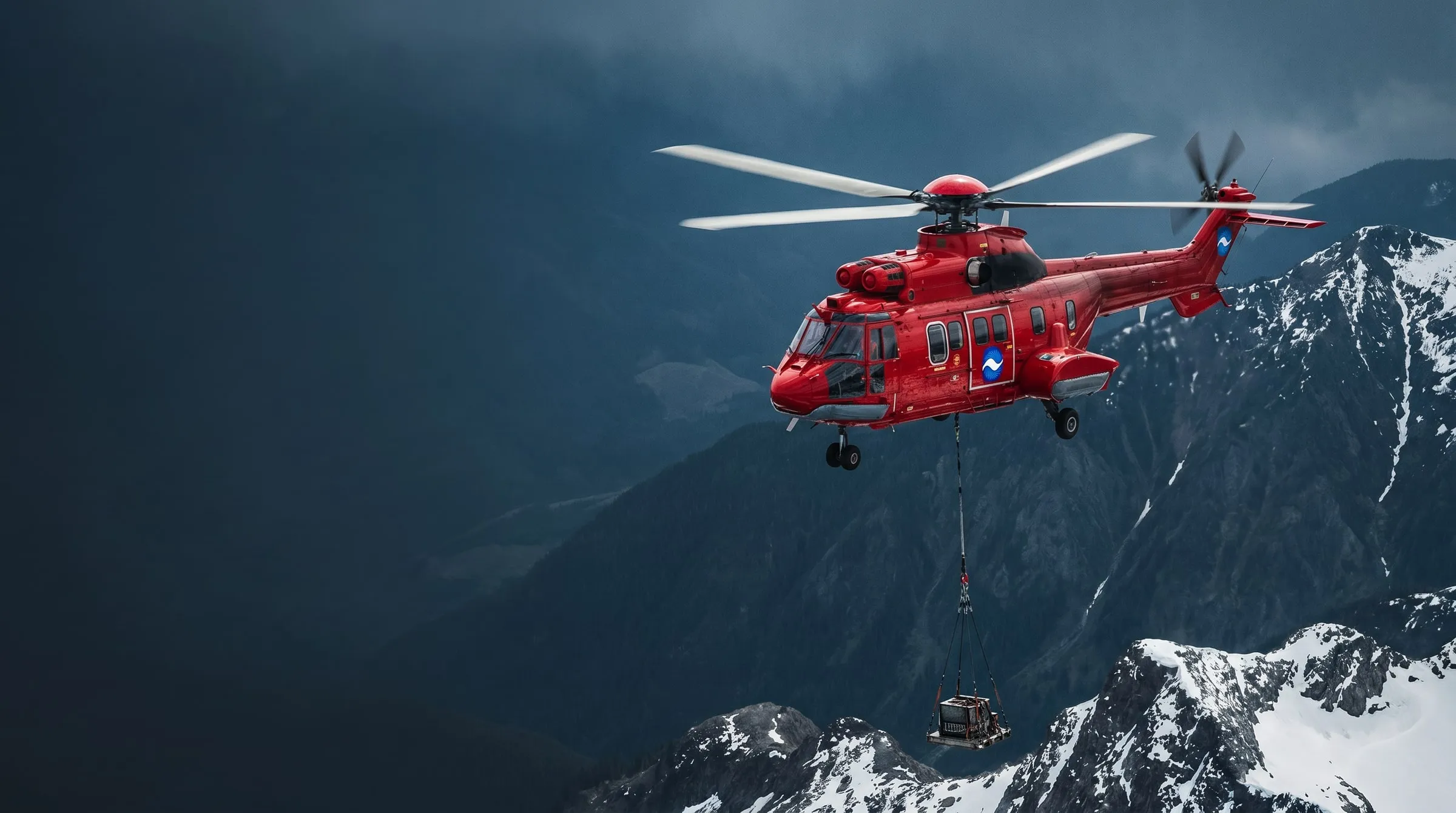 A red Coldstream Super Puma helicopter flying a precision long-line over a mountain valley